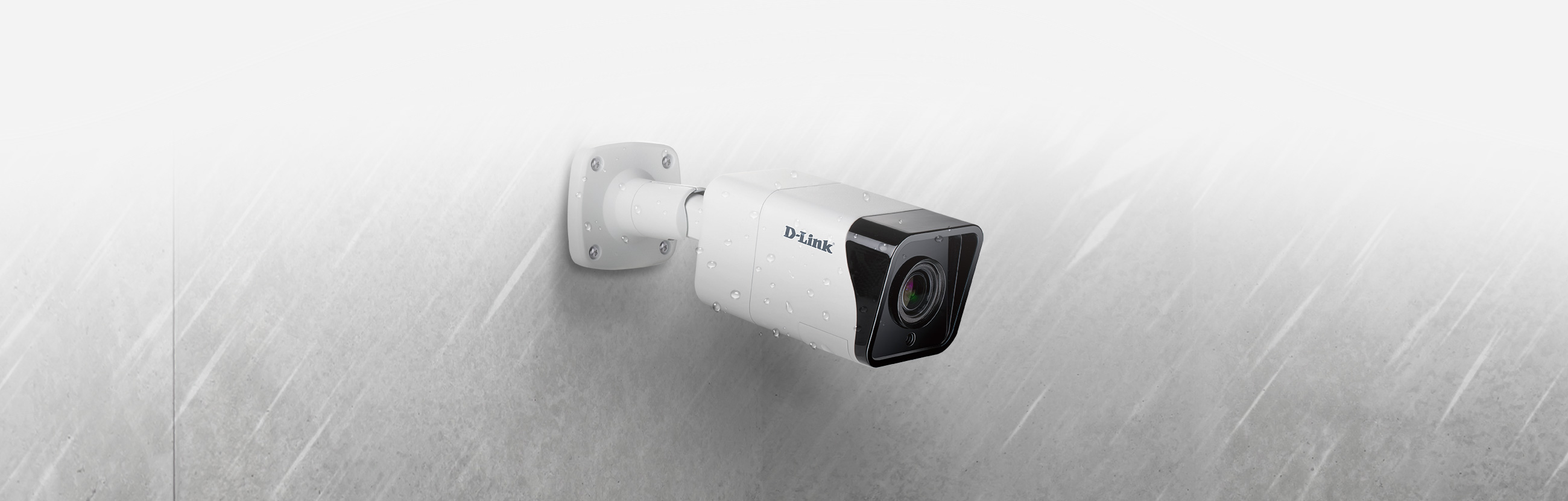 DCS-4712E Vigilance 2 Megapixel H.265 Outdoor Bullet Camera - mounted on a wall in the rain.