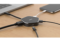 DUB-M420 USB-C to 4-Port USB 3.0 Hub - on a desk, connected to a laptop with example connections